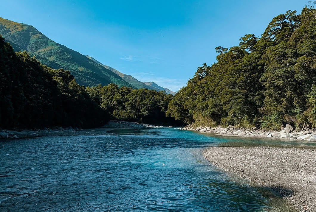 A shallow river running over pebbles